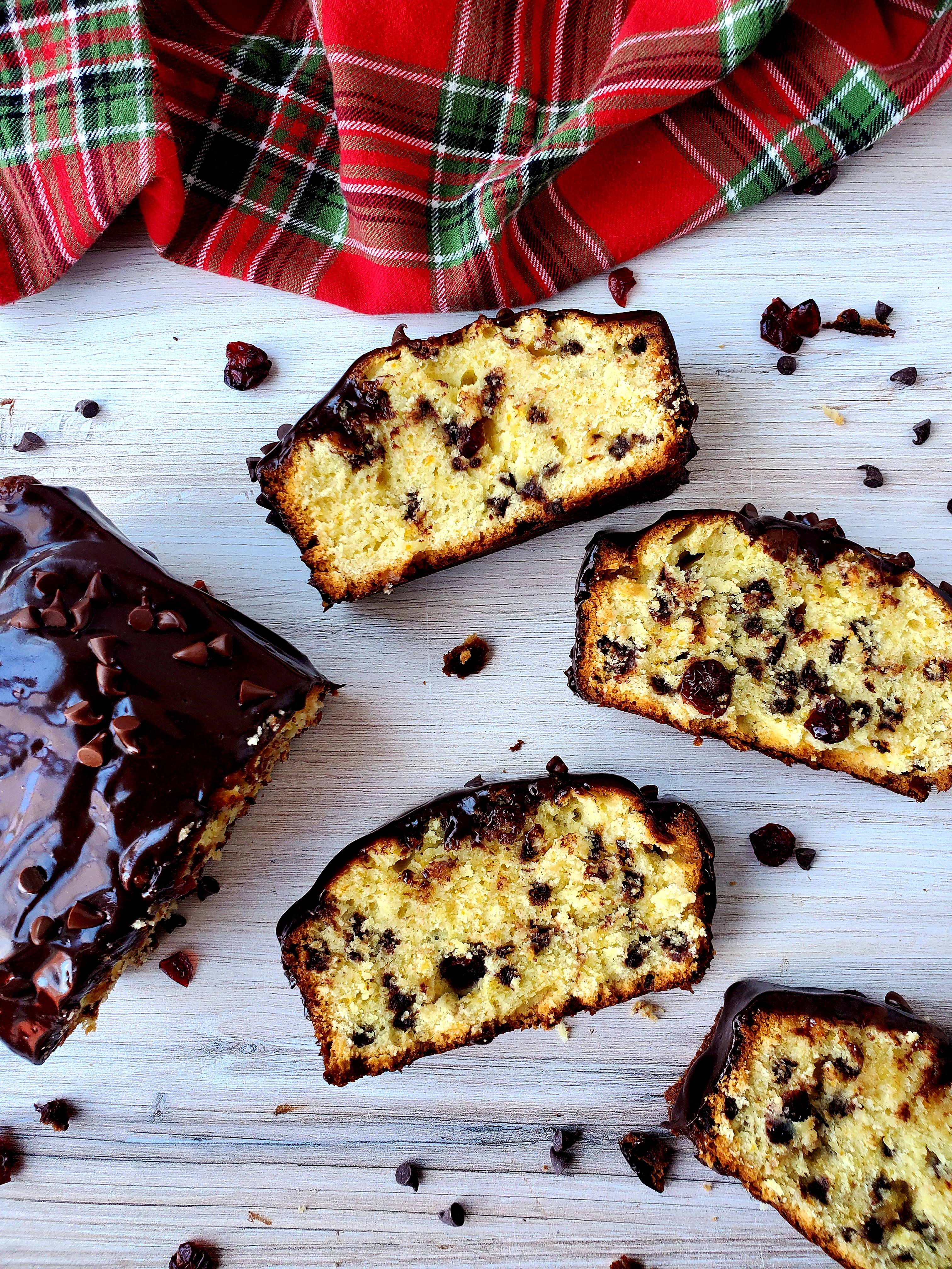 orange craisin chip pound cake slices and loaf