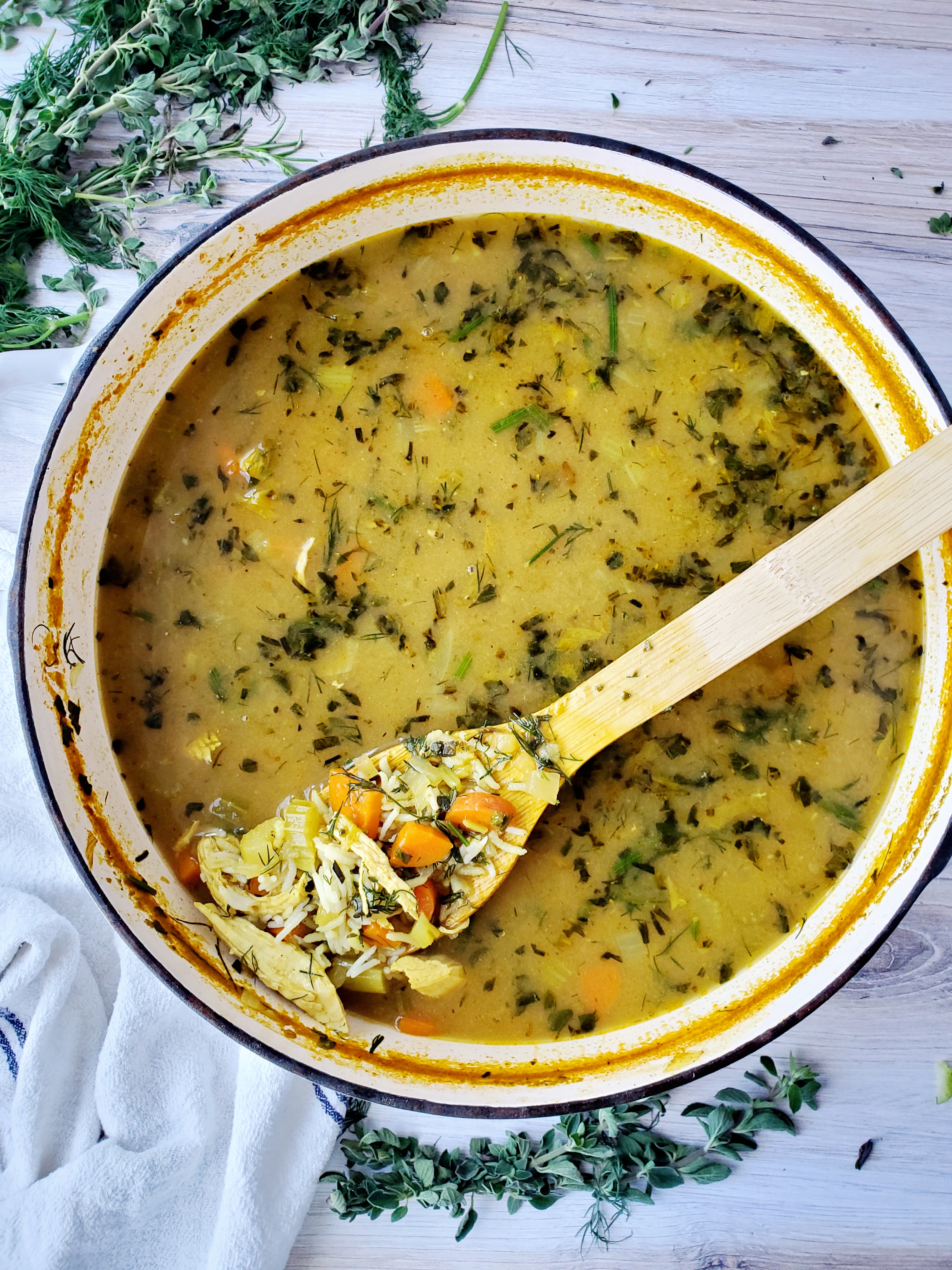 Comforting Chicken and Rice Soup in Le Creuset Dutch Oven with Bamboo spoon